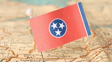 A flag of tennessee on top of a map.